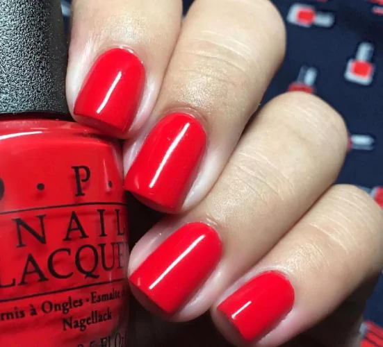 Classic Red Red, white, and blue July nails with cherries and checkerboard nail art for a patriotic vibe