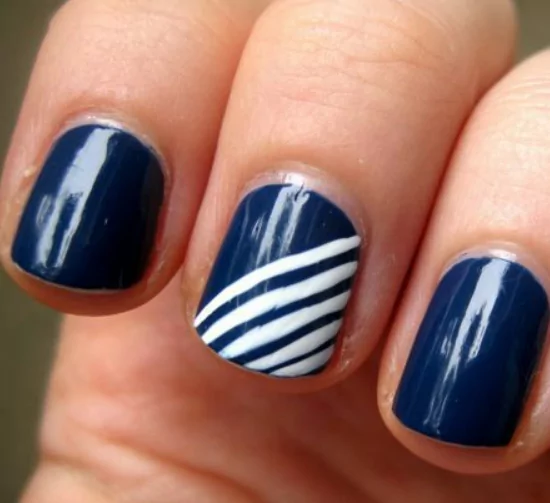 Midnight Navy Midnight navy nails with a deep glossy finish, elegant dark blue shade perfect for bold July nail colors and summer evening looks.
