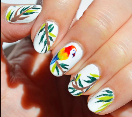 Tropical Paradise Duo Tropical paradise duo nails featuring vibrant pink and orange shades, inspired by sunset skies and perfect for bold July nail color combos.