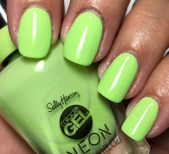 Electric Lime: The Neon That's Actually Wearable Lemon yellow nails with polka dots, inspired by Hailey Bieber’s citrus manicure trend