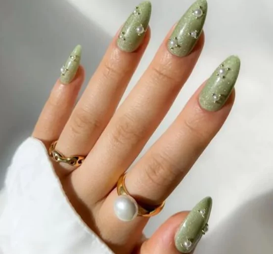 Sage Green Solid lime green nails with white stripes and fruit decals for a playful July style